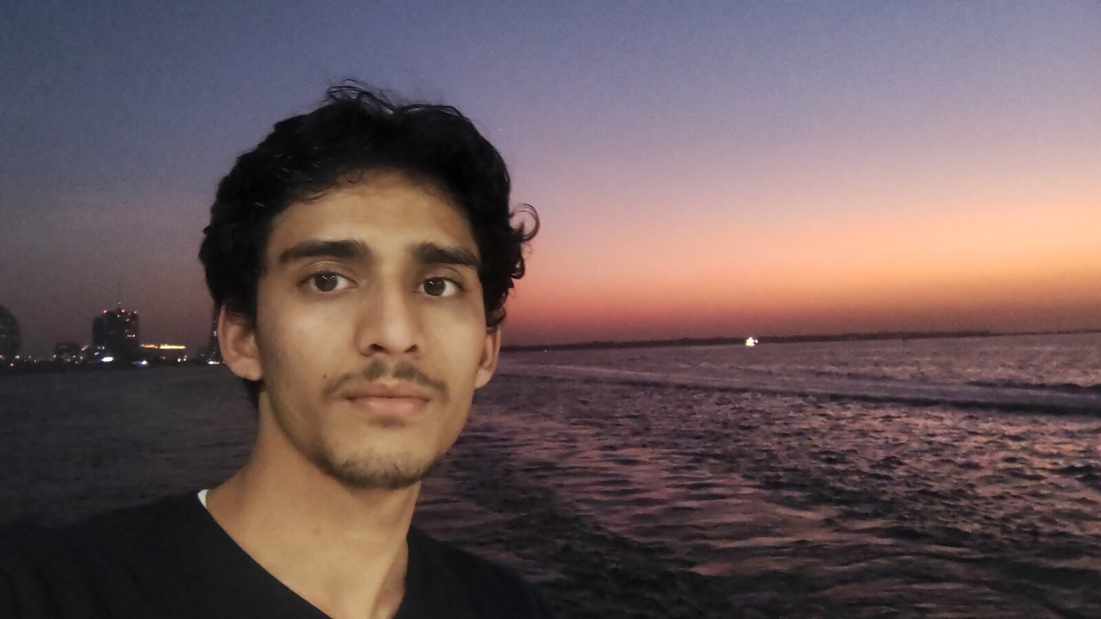 Mohsin by the water at sunset